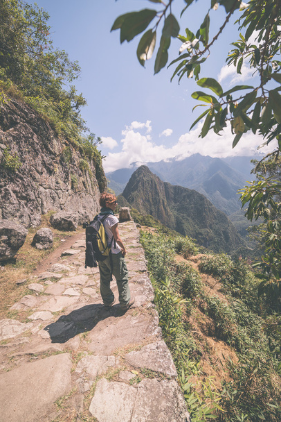 Exploring Machu Picchu, Peru, toned image - Фото, изображение
