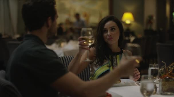 couple toasting with wine in restaurant - Filmmaterial, Video