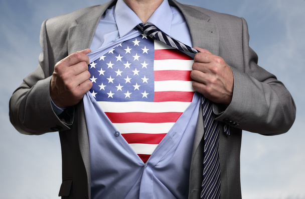 Superhero businessman revealing American flag - Foto, imagen