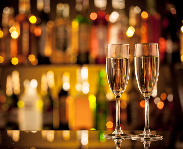 Glasses of champagne on bar counter - Фото, зображення