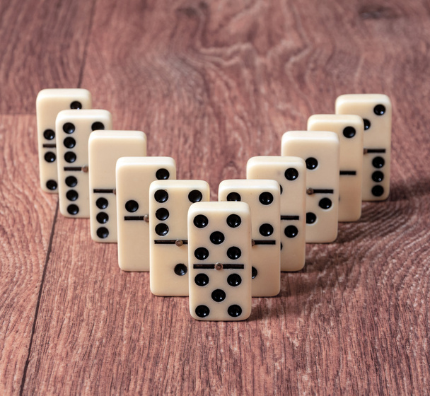 domino pieces on the brown wooden table background - Photo, Image