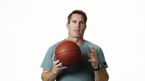 Man holding basketball - Footage, Video