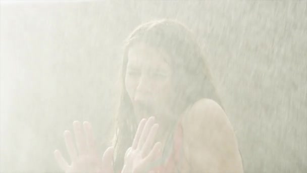water spraying on surprised woman - Video, Çekim