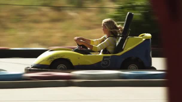Woman and man riding go-carts - Footage, Video