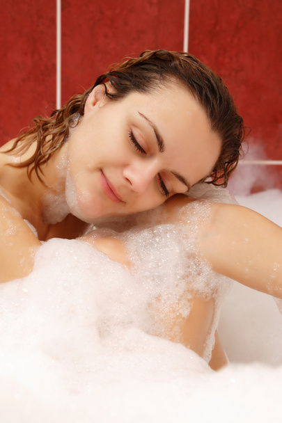 Young woman enjoys bath-foam - Foto, Imagen