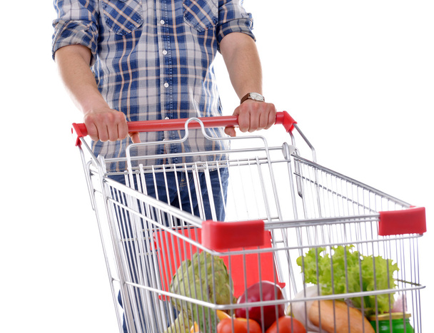 Young man with shopping cart - Zdjęcie, obraz