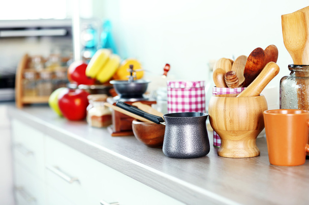 Composition with different utensils on wooden wooden table in kitchen - Фото, зображення