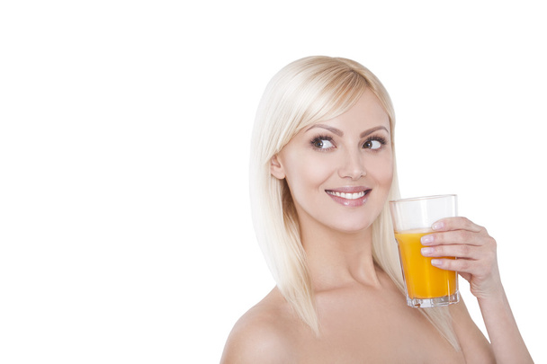 Young woman with glass of orange juice. Female model happy smile. - Foto, Imagen