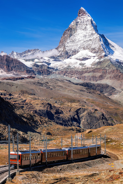 Matterhorn peak with a train in Swiss Alps, Switzerland - Photo, Image