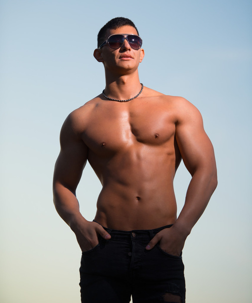 Fashion portrait of a sporty, athletic, muscular sexy man - Фото, зображення