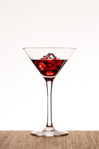 Red cocktail on the wood table - Φωτογραφία, εικόνα