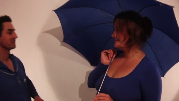 Man Coming to Woman with Umbrella - Filmati, video