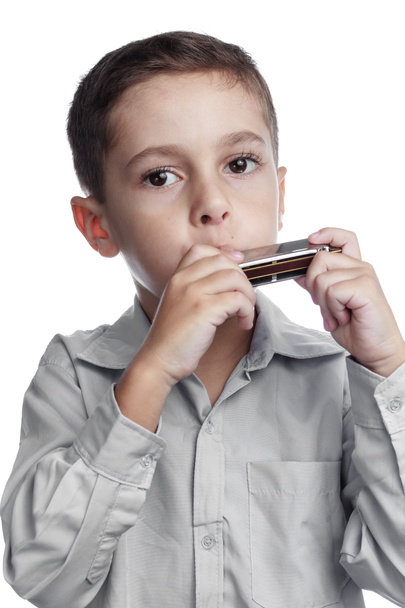 Child playing harmonica - Photo, Image