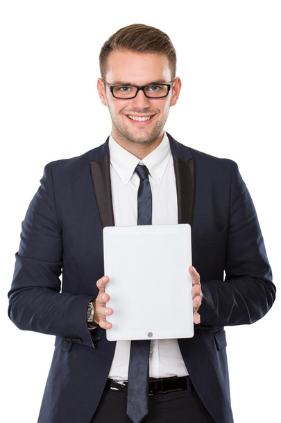 Businessman presenting a tablet pc, smiling - Foto, afbeelding