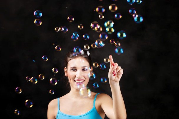 Happy girl and soap bubbles - Foto, imagen