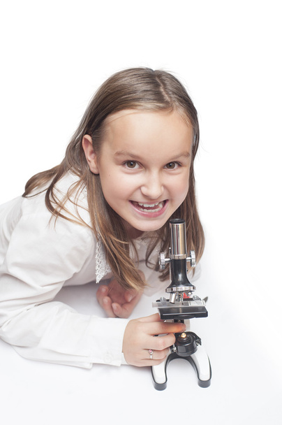 girl with a microscope - Foto, Imagen