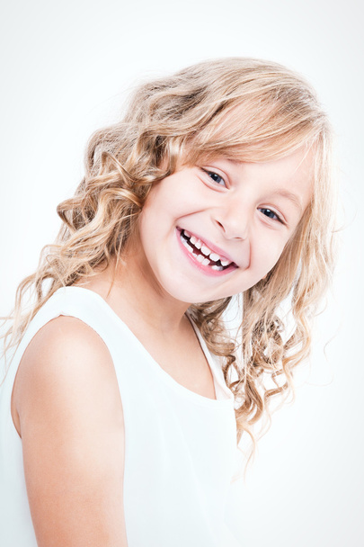 Portrait of a beautiful cheerful little girl. - Photo, Image