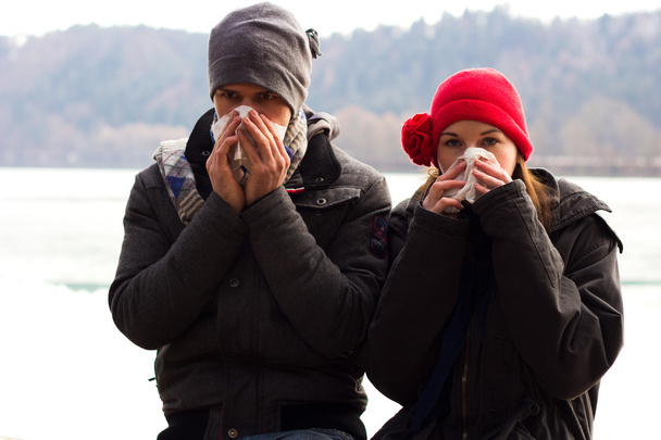 A Young Couple Next To Each Other Blowing Their Noses - Photo, Image