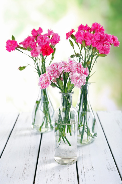 Beautiful bouquet of pink carnation in vases - Fotoğraf, Görsel