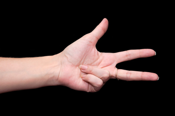 Mujer mano mostrando tres dedos
 - Foto, imagen