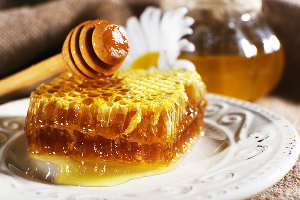 Honey products on plate closeup - Фото, изображение