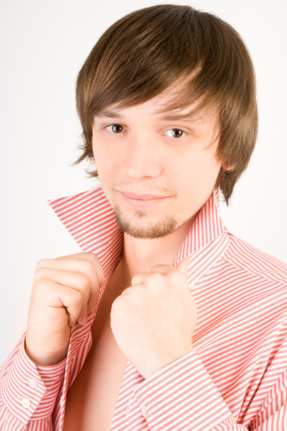 Beautiful self-confident man in shirt looking to the camera - Foto, Bild