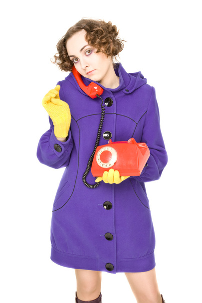 Girl with old red telephone - 写真・画像