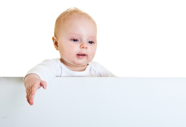 Isolated beaufiful caucasian infant baby behind whiteboard - Foto, Imagem