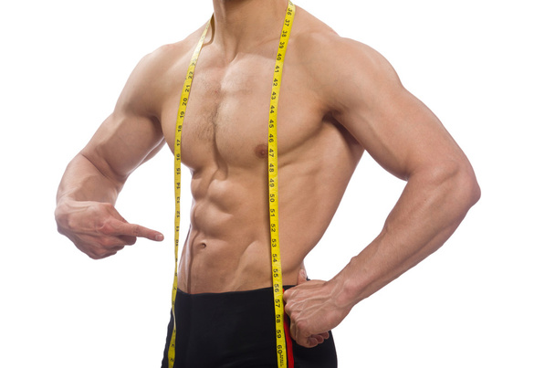 Muscular man measuring his muscles - Foto, imagen