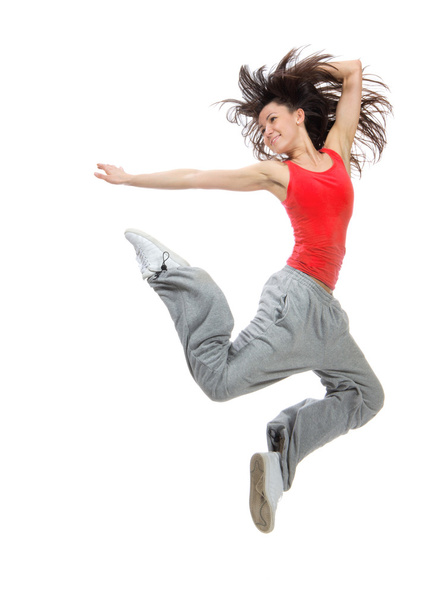 Modern teenage girl dancer jumping and dancing hip-hop in red ts - Photo, Image
