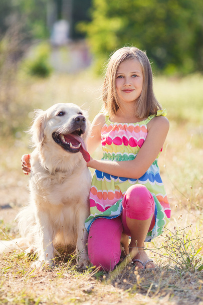 Portrait of a Girl with her beautiful dog outdoors. - Photo, image