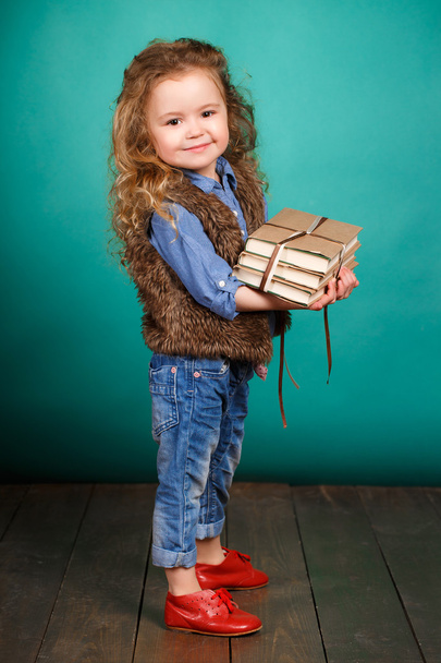 Little girl with books. - Photo, image