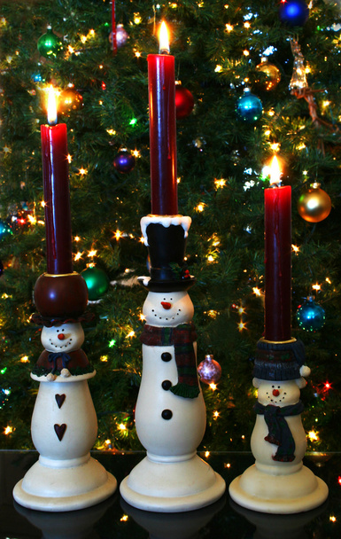 Un trío de velas de muñeco de nieve
 - Foto, imagen