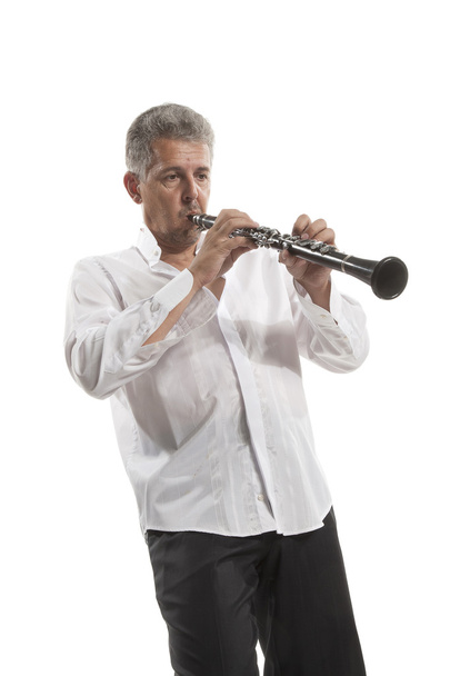 Hombre tocando clarinete
 - Foto, Imagen