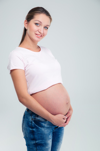 Portrait of a happy pregnant woman - Foto, afbeelding