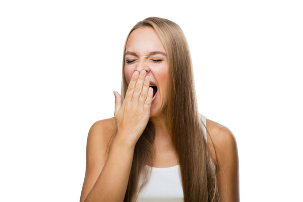 Mujer bostezos de aburrimiento sobre fondo blanco
 - Foto, Imagen