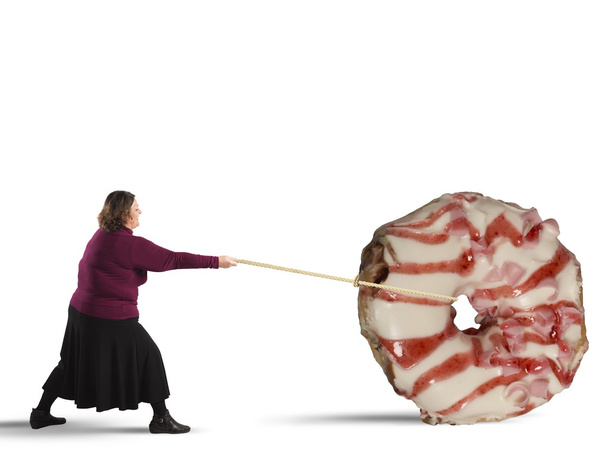 Nainen köyden vetämällä donitsi
 - Valokuva, kuva