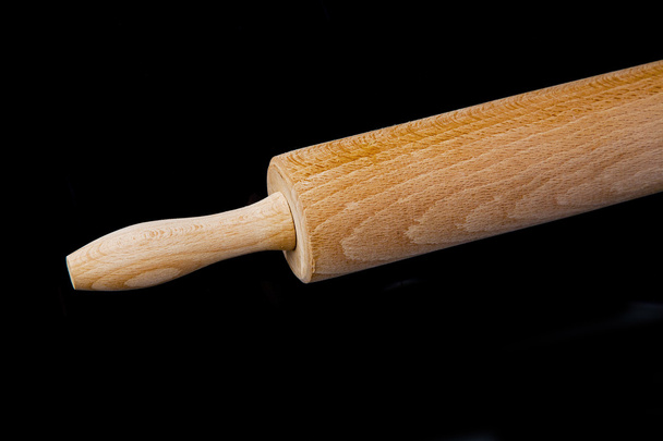 close up of rolling pin on black background - Фото, зображення