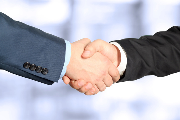 Close-up image of a firm handshake  between two colleagues - Photo, Image