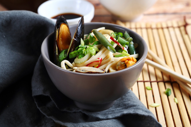 Noodles with seafood in a bowl - Photo, image