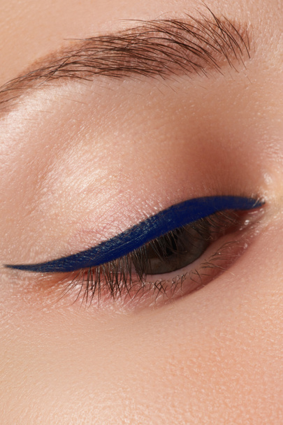 Beauty make-up for blue eyes. Perfect skin, long eyelashes. Classic blue arrows makeup. Retro make up. Eyeliner makeup - Photo, Image