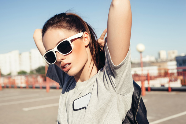 Glamorous young sexy woman in white sunglasses - Фото, зображення