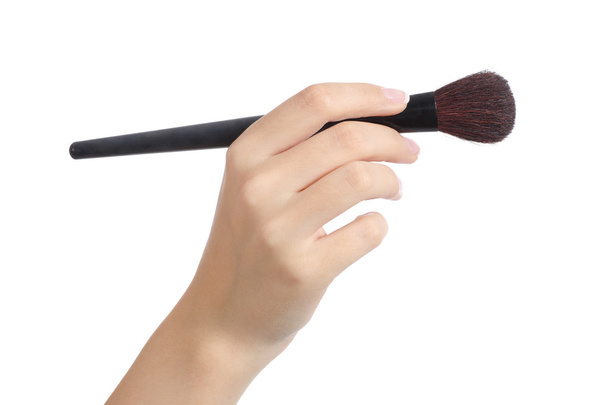 Woman hand using a makeup brush - Foto, afbeelding