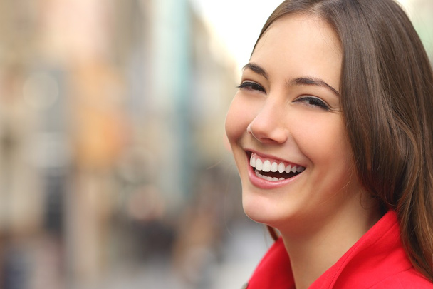 Woman white smile with a perfect teeth in the street - Photo, image