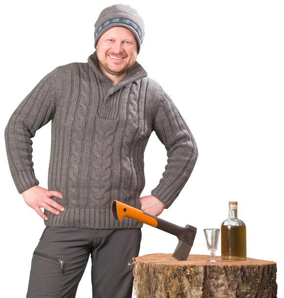 Forester with axe and bottle of alcohol smiling - Φωτογραφία, εικόνα