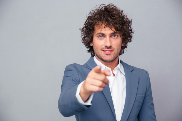 Businessman pointing finger at camera - Foto, afbeelding
