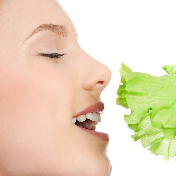 Young beauty woman with green lettuce - Foto, Imagen