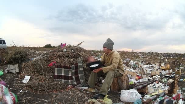 man unemployed homeless dirty looking food dump waste in landfill  social video - Footage, Video