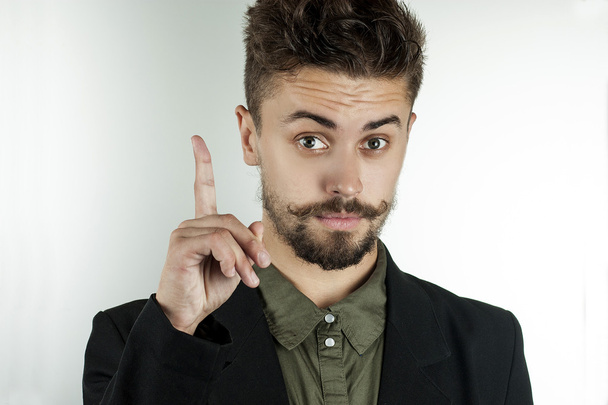 man in stylish clothes held up an index finger - Fotó, kép
