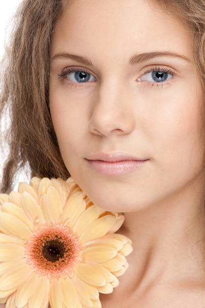 Beautiful girl with perfect skin and flower - 写真・画像